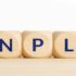 Tre dadi con lettere che formano l'acronimo "NPL"